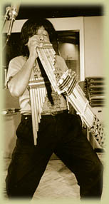 Miguel Angel Puna plays zampoñas during the 1992 Saint Paul Sunday session.